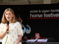 Tarly Stiens reading bush poetry at the Horse Festival finale. Photography by Mandy Kennedy.