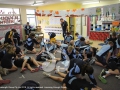 Organised chaos as St Marys year 5 and 6 practice CPR with instructor Cameron McFarlane looking on.