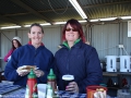 Dayna Hynes and Amanda Mostyn, serving up plenty of warm food to raise money for the Murrurundi Preschool.