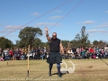 Luke Reynolds gives a victory wave after winning the whaet toss event.