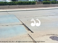 The surface of the road in front of the Cottage, with a hole which produces water each time a truck drives over it.