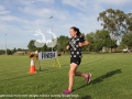 Kate Lloyd crossing the finish line in first place at the Scone fun run.