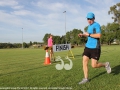 Shane Lloyd checking his watch as he runs in second at the Scone fun run.