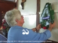 Di Brown placing a wreath in the Gundy hall.