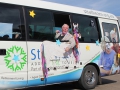 The residents of Strathearn enjoy the parade from the confort of their bus and blow bubbles to the crowd.