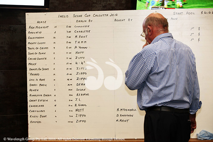 Les Cottam writing it all down at the Inglis Scone Cup Calcutta. Photographer: Mandy Kennedy.