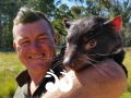 Dean Reid with his hand raised joey Diva at the Devil Ark near Scone.